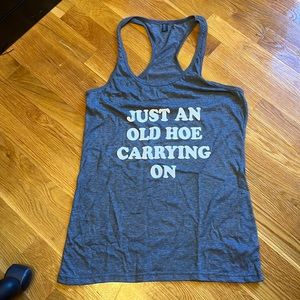 Gray size medium just an old hoe carrying on tank. Never worn